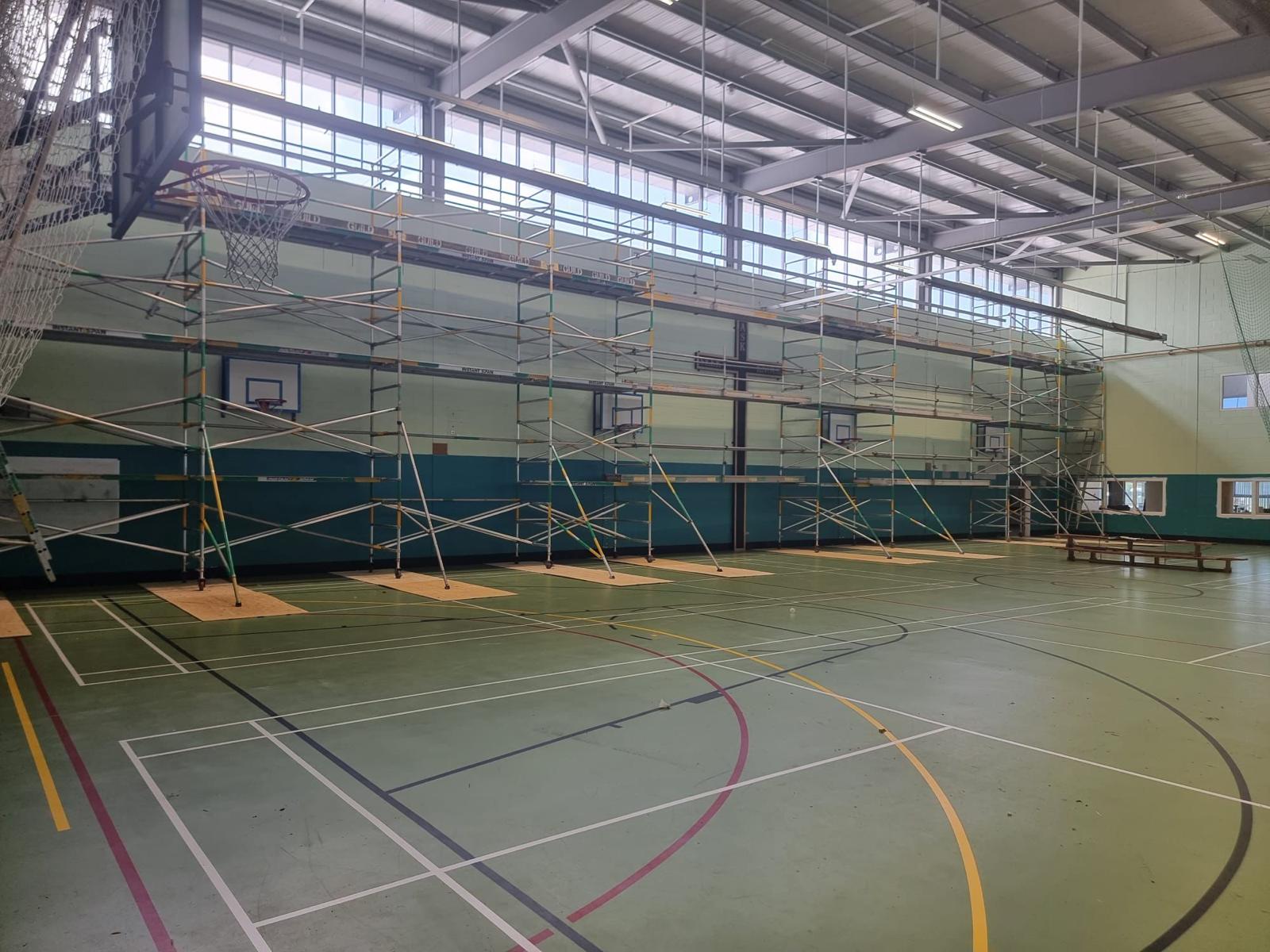 Indoor sports hall — multi-level access scaffold for a school or gym refit